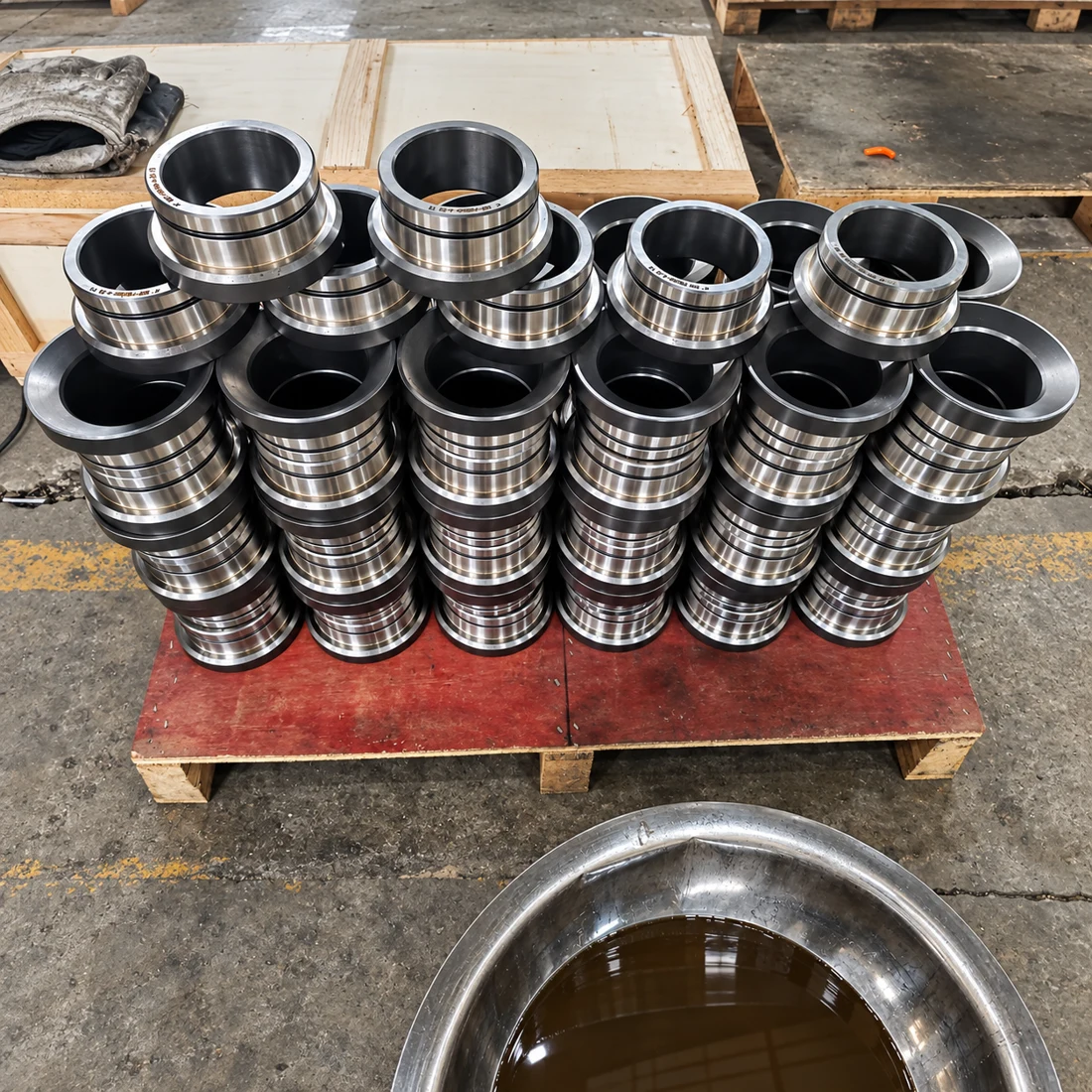 Stacks of machined valve seats in the workshop